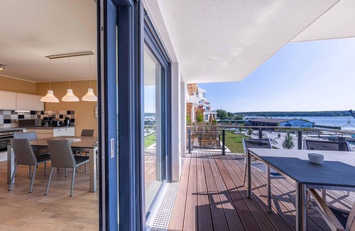 Muritz Apartment | Modern 5-star vacation apartment Müritzsonne with south-west facing balcony and Müritz view