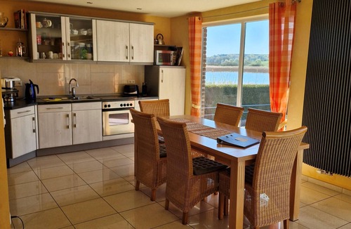 Blankensee House | Spacious vacation home right on the lake with terrace, fireplace and own rowing boat