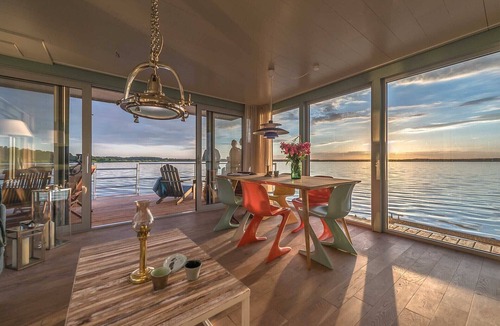 Uecker-Randow Boat Rental | traumHaff houseboat La Péniche/Baltic Sea - design, sunset & sauna on board