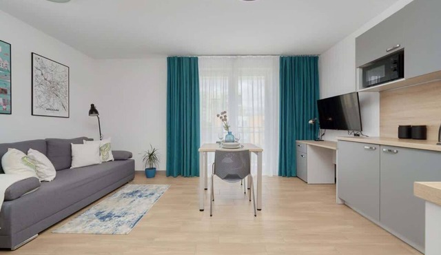 Functional Studio in Wroclaw | Balcony and Workspace