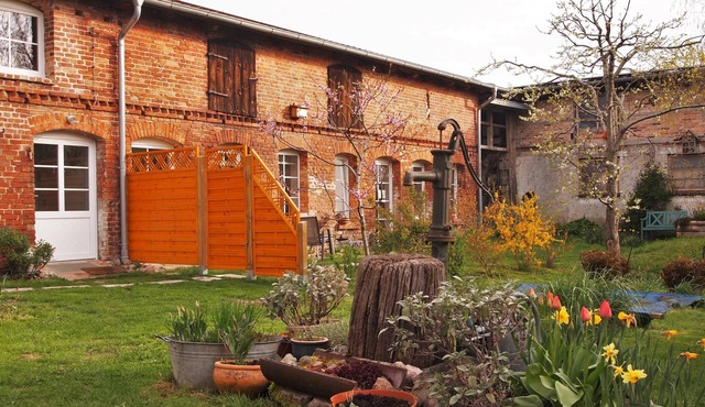 Idyllic farmhouse with a beautiful inner courtyard with a natural garden